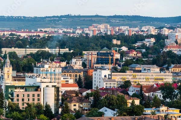 Fototapeta Aerial view over the city on the sunset with the University of Medicine and Pharmacy. Cluj Napoca, Romania.