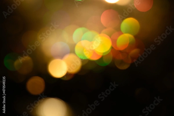 Fototapeta Multicolored glitter lights background. Blurry rainbow defocused circles. Abstract illuminated backdrop or overlay.