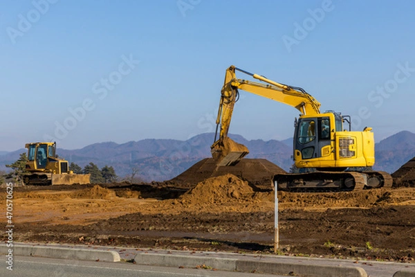 Fototapeta 土地を造成する油圧ショベル