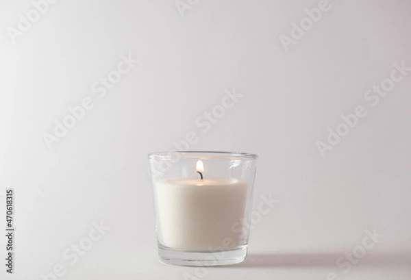 Fototapeta Christmas candle on a white background. New Year's concept.Copy space