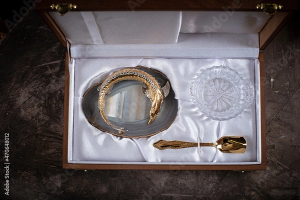 Fototapeta Caviar dish made of precious materials in the shape of a sturgeon fish in a gift box