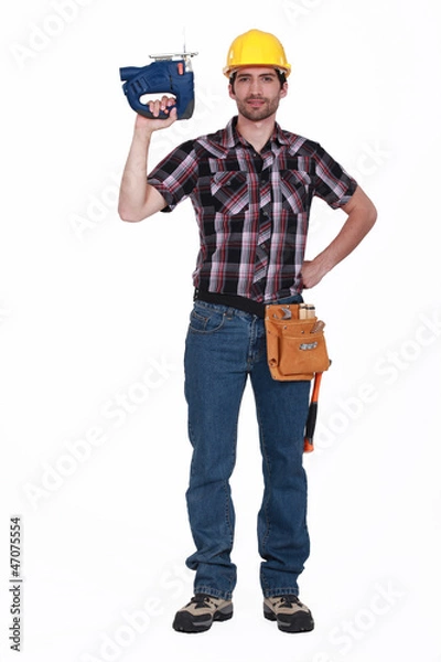 Fototapeta Carpenter holding chainsaw