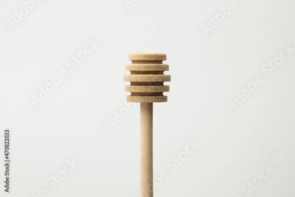 Fototapeta Close up of honey dipper isolated with white background. Honey dipper top view