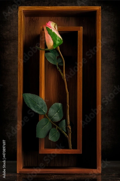 Fototapeta Still Life Image of a Pink Silk Rose in a Bamboo Box