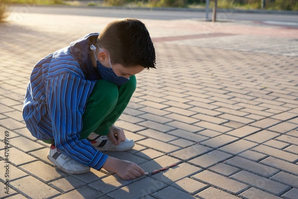 Fototapeta Kid playing with chinesse firecrackers called petardos in popular valencian fallas festivals