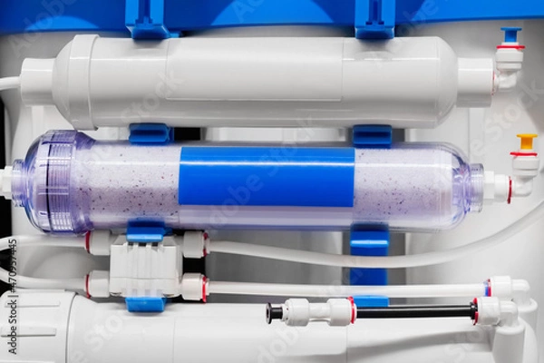 Fototapeta Photo of mounted plastic water filtering and clensing system.