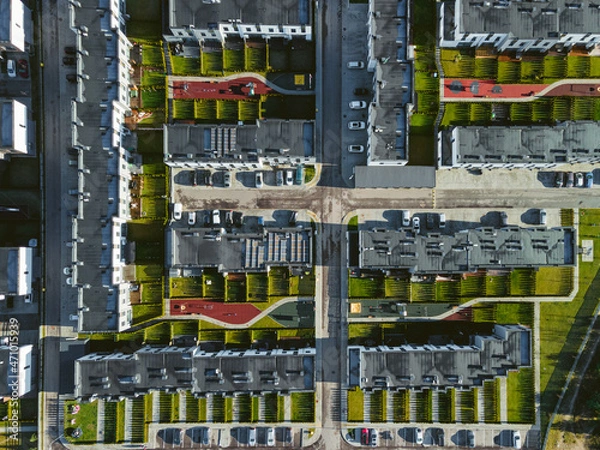Fototapeta Top view of fresh residential area in Vilnius. City shapes and lines of equally life in the modern town. Block cottages and flats with tiny yards. 