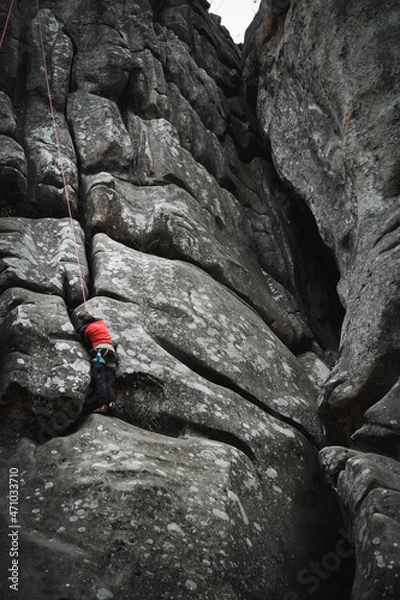 Fototapeta climber on a rock