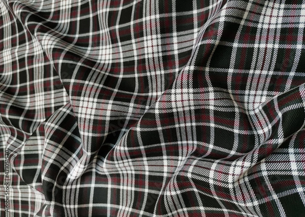 Fototapeta Gray tartan woolen school uniform fabric material. Scottish classic seamless flannel cloth. Traditional wave pattern for a Christmas background or wallpaper. Black, Green, Red and White checkered.