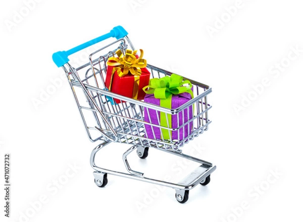 Fototapeta Shopping cart with colorful gifts, isolated on white background
