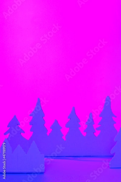 Fototapeta Futuristic modern abstract happy New Year 2022, Merry Chrstmas concept. Pine tree from paper on neon bright violet blue background, copy space, banner for your site, invitation, flyer