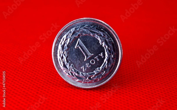 Fototapeta Polish zloty coin on red. Inflation problem