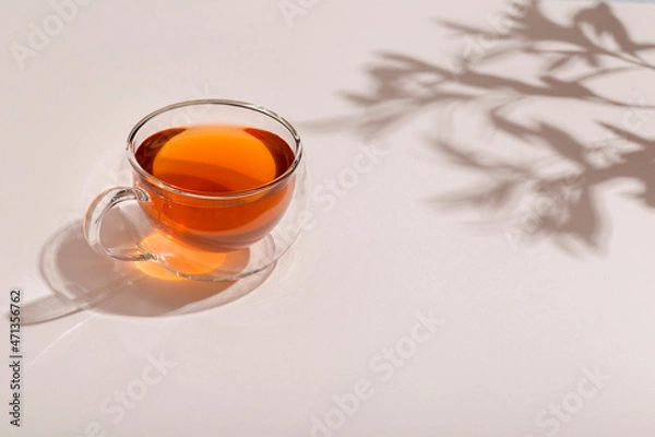 Fototapeta glass cups of tea on lightn table
