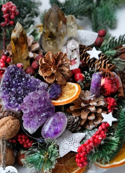 Fototapeta Crystal gemstones and natural winter decor close up. Altar with energy healing minerals for Witchcraft Ritual. Esoteric, relax, life balance concept. Christmas, Magical Winter Solstice. top view