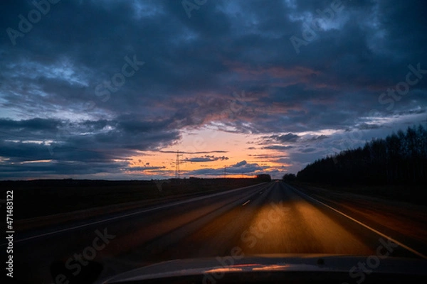 Obraz Driving on the highway at sunset