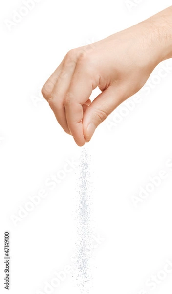Obraz Ręczne dodawanie soli na białym tle