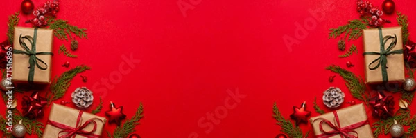 Fototapeta Christmas composition with decorations and ornametns on red background with empty space