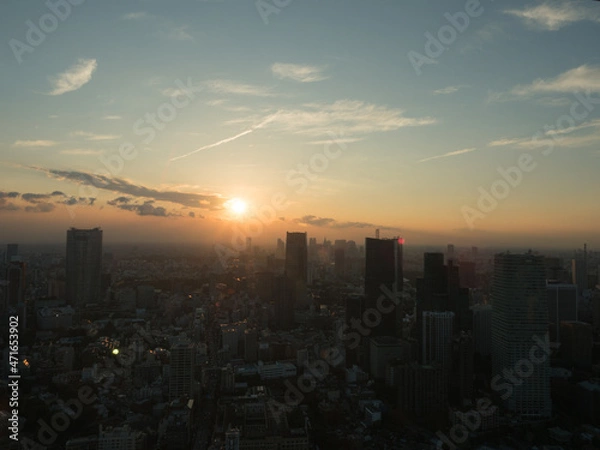 Fototapeta 摩天楼と夕日。Skyscraper and sunset.