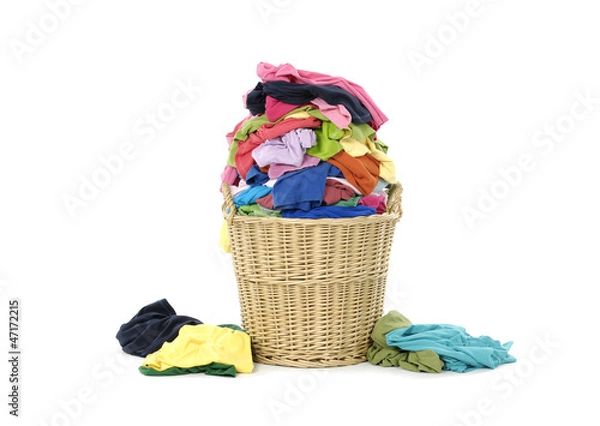 Fototapeta full of colorful shirts in a wicker basket
