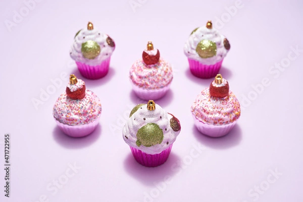 Fototapeta Different Xmas baubles in form of cupcake