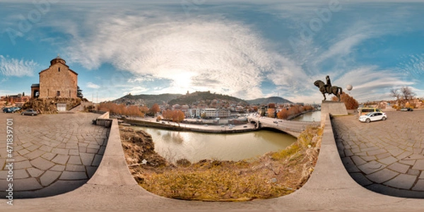 Obraz Tbilisi, Georgia - 2021: City center of Tiflis. Kura bridge. Summer. Blue sky. 3D spherical panorama with 360 viewing angle. Ready for virtual reality. Full equirectangular projection.