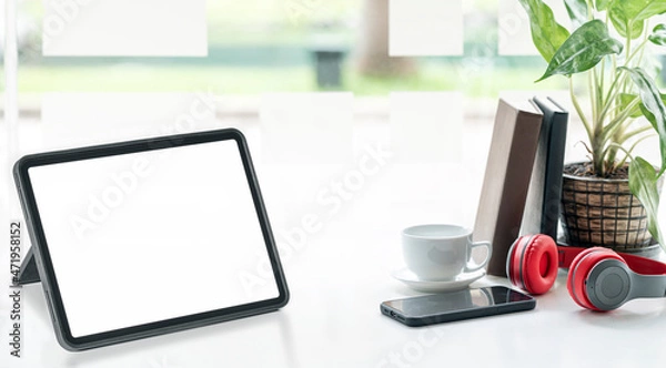 Fototapeta Mockup blank screen portable tablet and gadget on white top table.