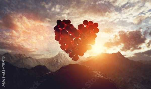 Fototapeta Balloons in heart shape at sunset in mountains. Valentine's day