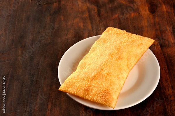 Obraz fried pastry served on the plate on wooden table