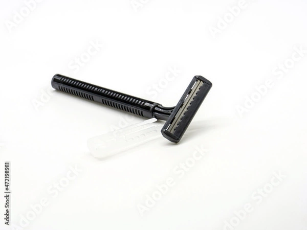 Obraz disposable black shaver on a white background