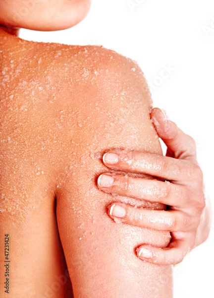 Fototapeta Beautiful young woman scrubbing body.