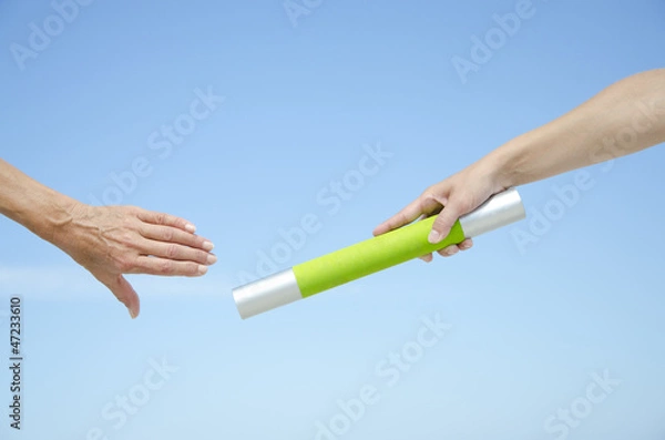 Obraz Isolated athletes hands with baton
