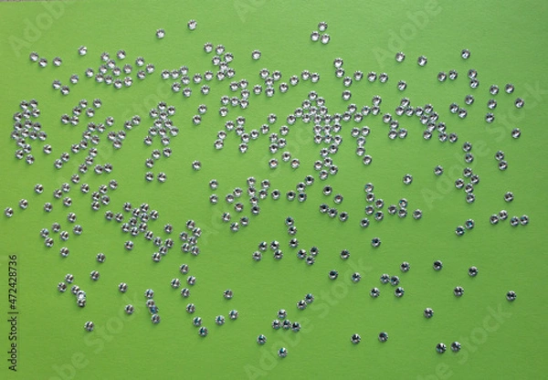 Obraz rhinestones on a green background, top photo. design for text