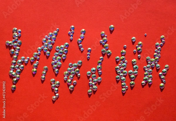 Obraz rhinestones on a red background, top photo. design for text