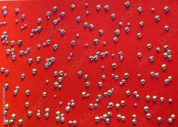 Obraz rhinestones on a red background, top photo. design for text