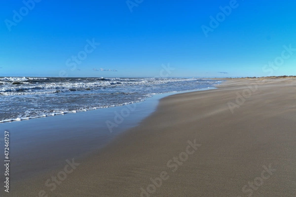 Fototapeta Piémanson beach in winter with wind, sand and waves. Camargue.