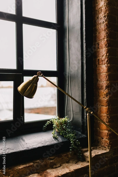 Fototapeta dark interior with a lamp in a room with a window