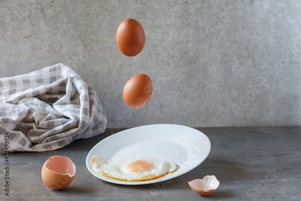 Fototapeta Scrambled eggs cooking .Concept