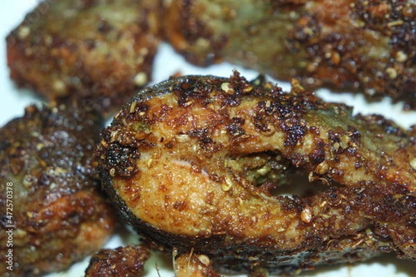 Obraz Spicy and crunchy barbecue of fried fish fillet on a white background