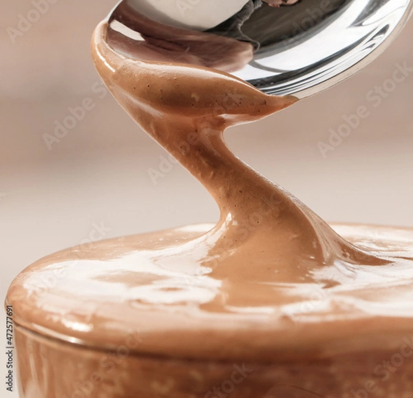 Obraz moving spoon in dalgona coffee cream in closeup