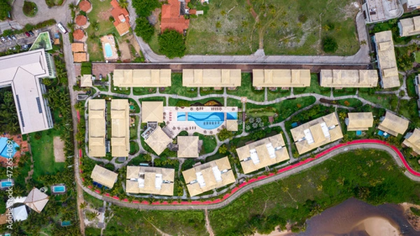 Fototapeta Aerial view of Imbassai beach, Bahia, Brazil. Beautiful beach in the northeast with a river and palm trees.