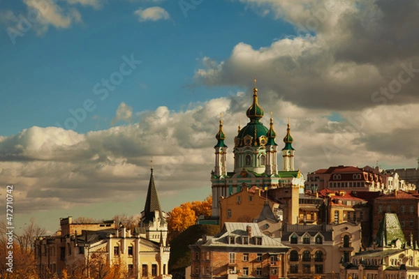 Fototapeta Panoramic view of the church on the city against the blue sky