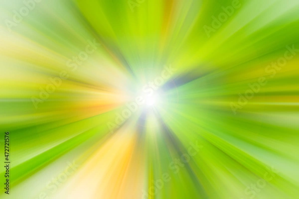 Fototapeta Bright yellow and green rays with white flash in the center