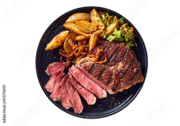 Fototapeta Appetizing steak and potatoes on plate