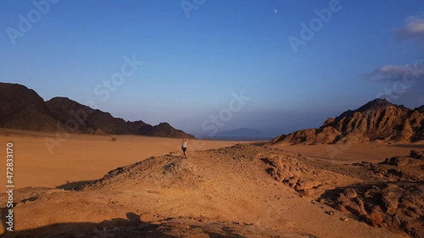 Obraz image of the desert and mountains on the Sinai Peninsula at sunset. The Sinai Desert is an attraction accessible to vacationers of all resort areas of Charm.excursion in Egypt.