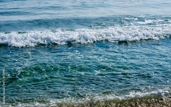 Obraz Blue foamy sea wave close up.