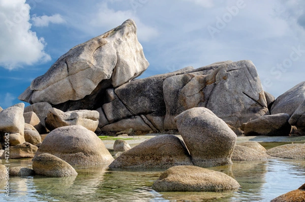 Obraz Granite boulders against the blue cloudy sky.