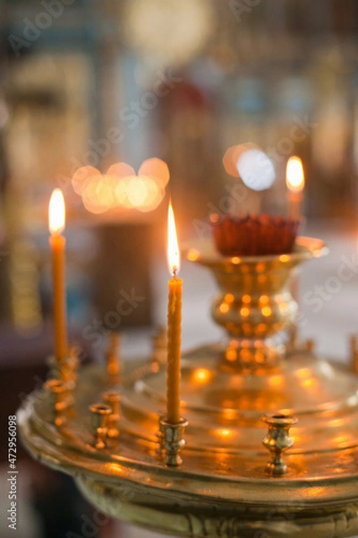 Fototapeta burning candles in church