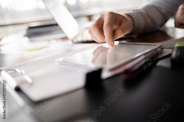 Fototapeta Student surf the internet. Manager workplace at home. The economist considers finance expenses in a new startup. A man makes a report to the company.