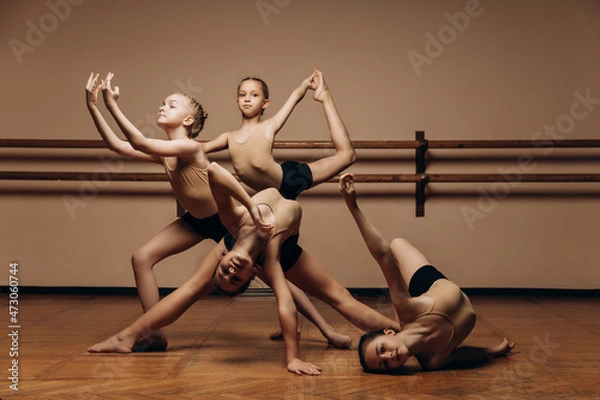 Fototapeta image of a group of modern little ballerinas standing in a modern dance pose. Copy space
