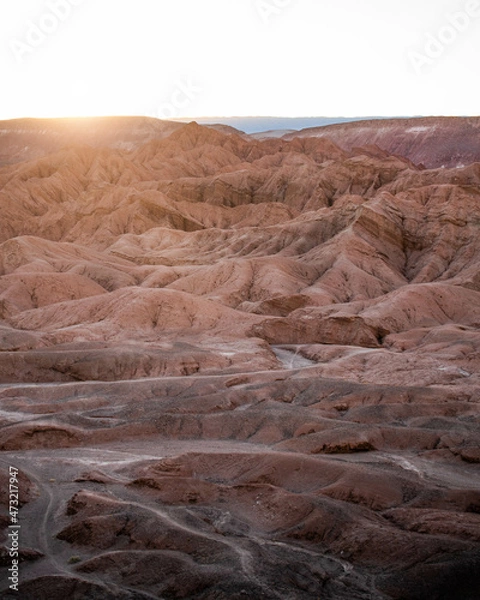 Fototapeta A landscape that looks like mars, with red mountains at sunset in the desert of Atacama, Chile